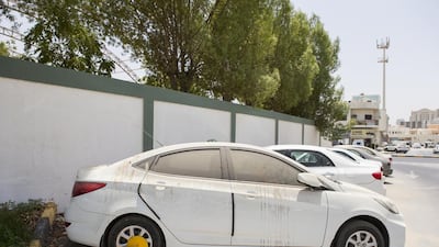 An car tyre is clamped in front of Al Maarefa School in Al Yarmook neighbourhood in Sharjah. Reem Mohammed / The National
