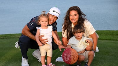 Thorbjorn Olesen of Denmark and his family celebrate victory with the Ras Al Khaimah Championship trophy on the 18th green. Getty Images