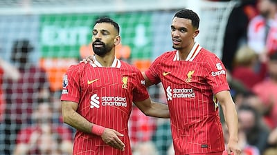 Mohamed Salah celebrates scoring with teammate Trent Alexander-Arnold. EPA