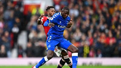 Everton midfielder Abdoulaye Doucoure battles for possession with Fred of Manchester United. Getty