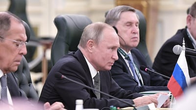 Mr Putin attends a meeting with King Salman. EPA