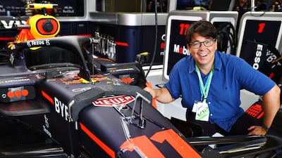 Comedian Michael McIntyre poses for a photo in the Red Bull garage. Getty