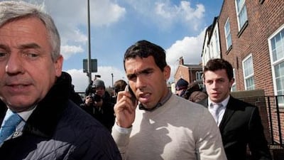 Carlos Tevez left the UK before completing a majority of the 250 hours of unpaid work. Jon Super / AP Photo