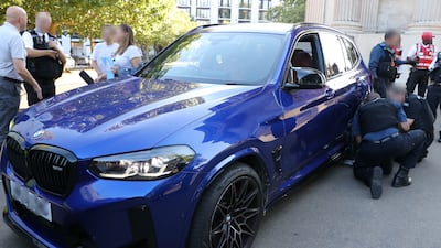 Police officers with a BMW X3M. Photo: Metropolitan Police