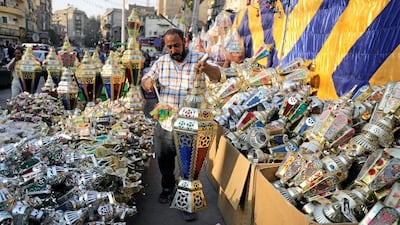 An Egyptian seller dusts a traditional Ramadan lantern called "fanous" at his shop stall ahead of the Muslim holy month of Ramadan in Cairo, Egypt May 24, 2017. Mohamed Abd El Ghany/Reuters