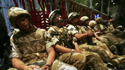 British soldiers rest while arriving for their deployment to Camp Bastion in Helmand province in 2006