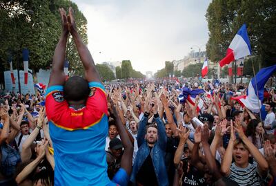 French supporters cheer on the Champs Elysees after France won the soccer World Cup final against Croatia on July 15, 2018. Francois Mori / AP Photo