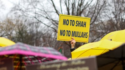 A person holds a placard, as demonstrators and activists rally in support of nationwide protests in Iran, outside the White House in Washington. Reuters