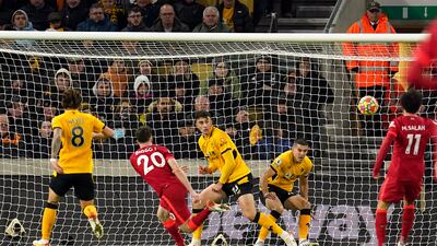 Liverpool's Diogo Jota sees his shot blocked on the line by Wolves defender Conor Coady. PA