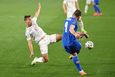 Spain's midfielder Sergio Canales (left) challenges Giorgos Masouras. AFP