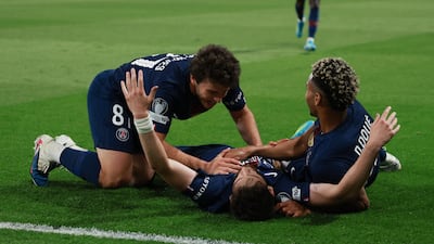 Khvicha Kvaratskhelia celebrates with teammates after scoring PSG's fourth goal. Reuters