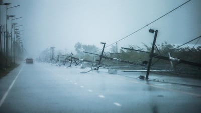 Fallen electricity poles are seen along a road as tropical storm Pabuk approaches the southern province of Nakhon Si Thammarat, Thailand. Reuters
