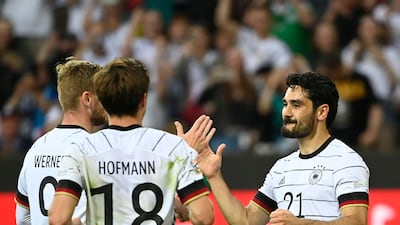 Ilkay Gundogan (R) celebrates scoring the second for Germany. AFP