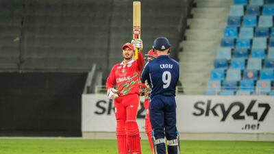 Ayaan Khan raises his bat after reaching his half century against Scotland. Photo: ICC