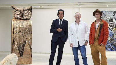 British artist Thomas Houseago, centre, poses with American actor Brad Pitt, right, and Australian musician Nick Cave at the Sara Hilden Art Museum in Tampere, Finland. AFP