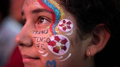 A Venezuelan football fan waits for the start of the 2024 Copa America quarter-final match between Venezuela and Canada at a Fan Fest in Caracas on July 5, 2024. The match ended 1-1 and Canada went through to the semi-finals after winning 4-3 on penalty kicks. AFP