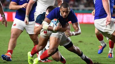 France's centre Gael Fickou (R) scores a try during the Japan 2019 Rugby World Cup Pool C match between France and the United States at the Fukuoka Hakatanomori Stadium in Fukuoka. AFP