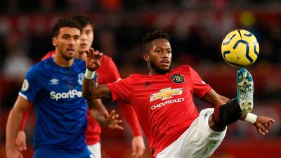 Manchester United's Brazilian midfielder Fred (R) controls the ball against Everton. AFP