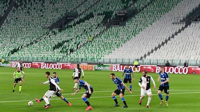 Inter Milan and Juventus players compete in an empty stadium during the Serie A match in Turin. AFP