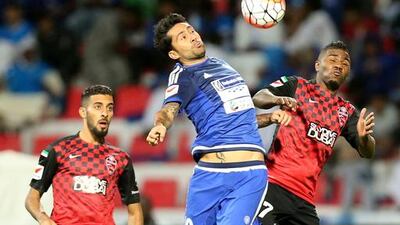 Al Ahli, in red and black, compete in an Arabian Gulf League match against Al Nasr on Dec 11, 2015 in Dubai. Ashraf Al Amra / Al Ittihad