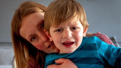 Katja comforts her son Oskar. AP Photo