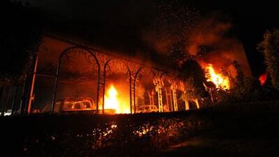 The US Consulate in Benghazi is seen in flames during a protest by an armed group.