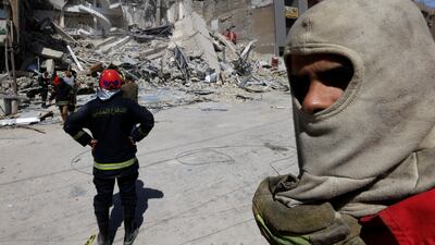 A four-storey commercial building in Baghdad collapsed on Saturday, trapping at least 13 people who were later rescued. Reuters