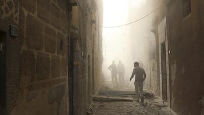 Men inspect a site hit by what activists was a barrel bomb dropped by forces loyal to Syria’s President Bashar al-Assad at Qadi Askar district of Aleppo. Mahmoud Hebbo / Reuters