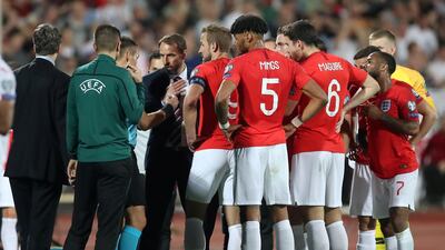 England players and manager Gareth Southgate speak to referee Ivan Bebek when the Euro 2020 match against Bulgaria was halted due to racist abuse. Reuters/Carl Recine