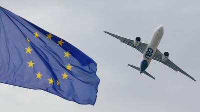 An Airbus A330neo flies over the European flag - Airbus says its first half deleveries rose 28 per cent. Reuters