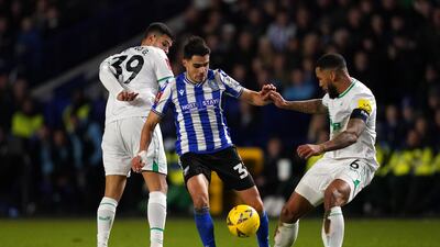 Players battle for the ball.