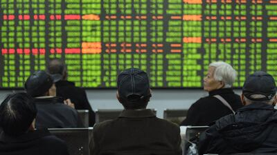 Investors look at a screen showing stock market movements at a securities company in Hangzhou in China's eastern Zhejiang province. Chinese stocks crashed on February 3 with some major shares quickly falling by the maximum daily limit as the country's investors got their first chance in more than a week to react to the spiralling coronavirus outbreak. AFP