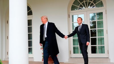 US President Donald Trump and French President Emmanuel Macron walk to the Oval Office. Pablo Martinez Monsivais / AP