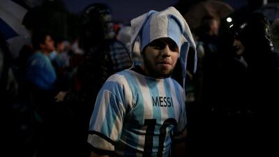 A fan of Lionel Messi wears his jersey at a rally to show the Argentine soccer player their support.