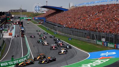 McLaren's Oscar Piastri leads going into the first corner at the start of the race ahead of teammate Lando Norris and Red Bull's Max Verstappen. Reuters