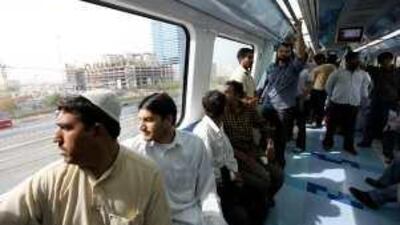 Passengers enjoy the train ride.