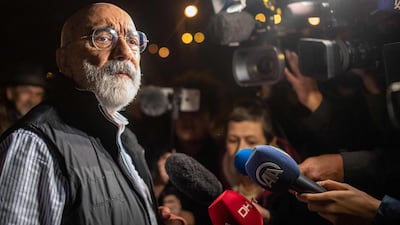 Turkish journalist and writer Ahmet Altan speaks to journalists after being released from prison on November 4 2019. AFP