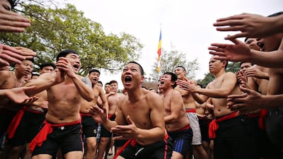 Villagers in Dong Ky, Vietnam cheer during the traditional firecracker festival. The festival is held annually from the fourth to the sixth day of the first lunar month to honour General Thien Cuong who helped the Hung Kings fight off invaders. Luong Thai Linh / EPA