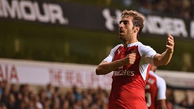 Arsenal's Mathieu Flamini celebrates scoring the winner for his team in their League Cup third round victory over Spurs on Wednesday night. Ben Stansall / AFP