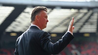 Manchester United manager Louis van Gaal waves to fans prior to his side's Premier League win over Everton on Sunday at Old Trafford in Manchester. Michael Regan / Getty Images / October 5, 2014