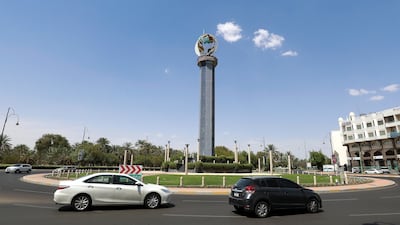 A roundabout in Al Ain featuring a globe and crescent on top of a column.
