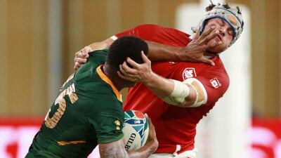 South Africa's Damian Willemse of South Africa attempts to fend off Andrew Quattrin of Canada. Getty