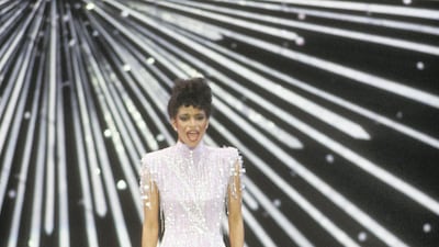 1982: Debbie Allen performs at the 1982 Oscars in a high-necked sequin gown featuring classic eighties power shoulders. Getty Images
