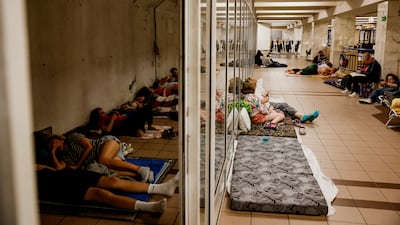 People take shelter inside a metro station in Kyiv, during an air raid alert, amid Russia's war on Ukraine. Reuters