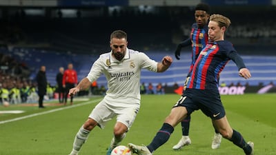 Barcelona's Frenkie de Jong, right, in action with Real Madrid's Dani Carvajal. Reuters