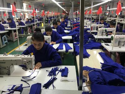 Factory workers in Hotan prefecture, Xinjiang. Centre residents often become factory workers