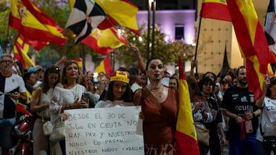 Ceuta residents carrying Spanish flags take part in a protest demanding government action to prevent a repeat of the mass migration from Morocco last month. AFP