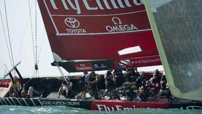 England cricketer Andrew Flintoff, bottom left, had an odd day out at sea as 18th man for Emirates Team New Zealand yesterday.