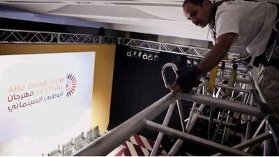 The Gear House lighting designer and technician Naveen Banger adjusts lights for a panel at the film festival yesterday.