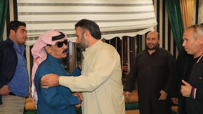 Souleyman is greeted as he arrives home. He had been detained for allegedly voicing support for Kurdish militants.